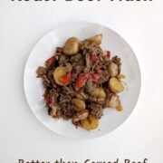 Roast beef hash with potatoes and red bell peppers on a plate. Text overlay reads "Roast Beef Hash. Better than Corned Beef. No Can. Easy As Cookies."