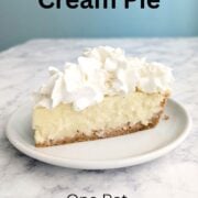 A slice of coconut cream pie with whipped cream on top. Text overlay reads "Coconut Cream Pie. One Pot. No Tempering Eggs. Easy As Cookies."