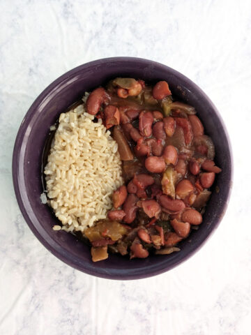 Vegetarian Slow Cooker Red Beans and Rice, in a purple bowl.