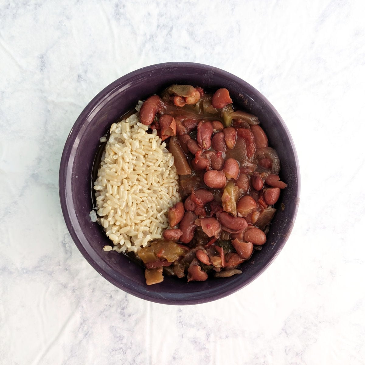 Vegetarian Slow Cooker Red Beans and Rice, in a purple bowl.